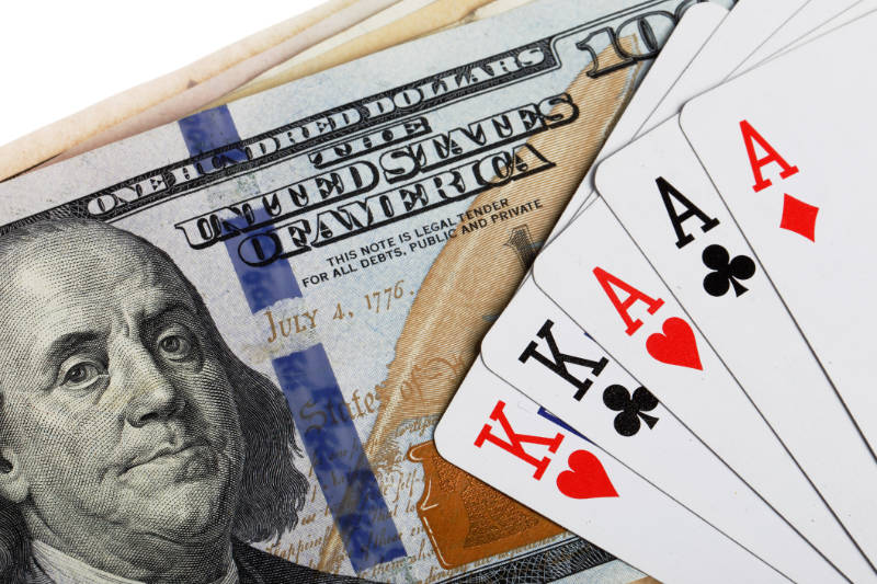 Full house poker hand with a one hundred dollar bill